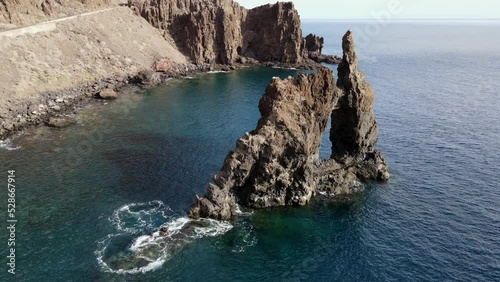 aerial shot in orbit over the Roque de la Bonanza on the island of El Hierro on a sunny day, Canary Islands. photo