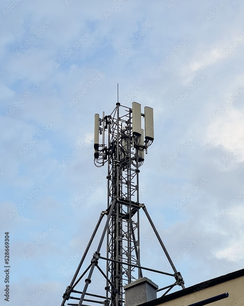 Technology on the top of the telecommunication GSM (5G,4G) tower with copy space.Cellular phone antennas on a building roof.Telecommunication mast television antennas.Development communication system Technology on the top of the telecommunication GSM (5G,4G) tower with copy space.Cellular phone antennas on a building roof.Telecommunication mast television antennas.Development communication system