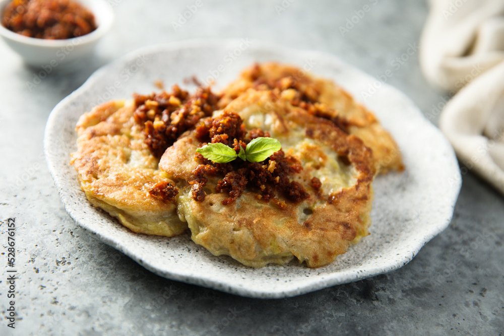 Homemade potato pancakes with red pesto