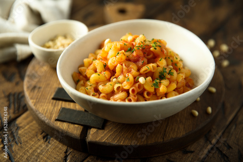 Pasta with tomato sauce and pine nuts