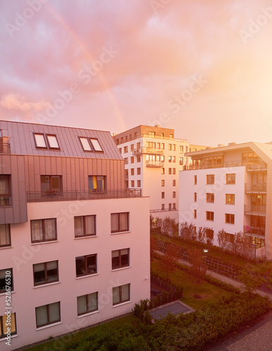 Residential apartment house facade architecture with outdoor facilities sunlight reflex. Modern residential building at sunny day. Apartments in residential area in a city. © AlexGo