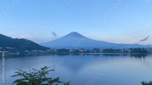 Magnificent Japanese traditional view, Mt Fuji at just after 5:30 am, the beautiful mountain silhouette revealed in whole after cloudy evening the day before. Photo taken year 2022 August 27th