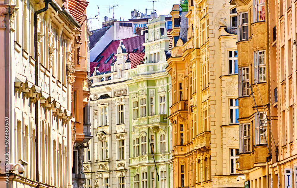 View of historical residential houses with gothic and classical ornaments and stucco decorations in the Old Town of Prague