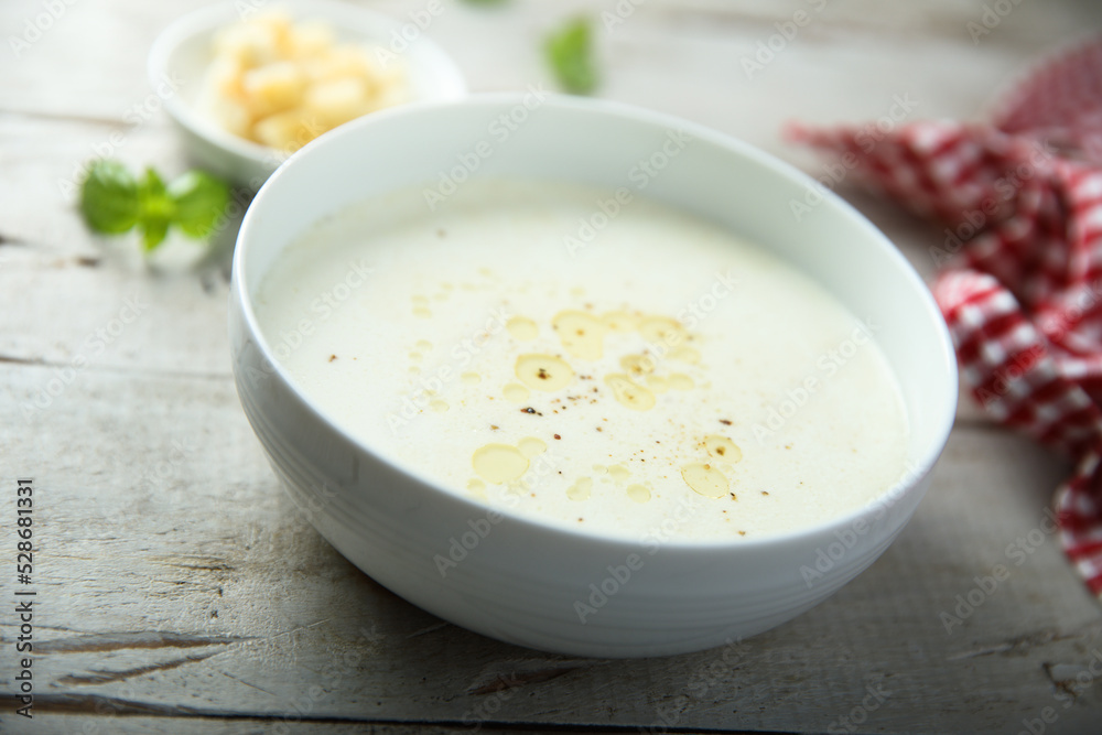 Traditional homemade cheese soup with croutons