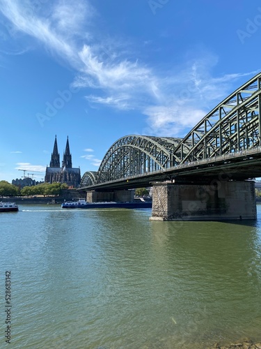 view of Hohenzollern Bridge over the river Rhine in Cologne. It is a most heavily used railway bridge in Germany accessible for pedestrians © Malvina