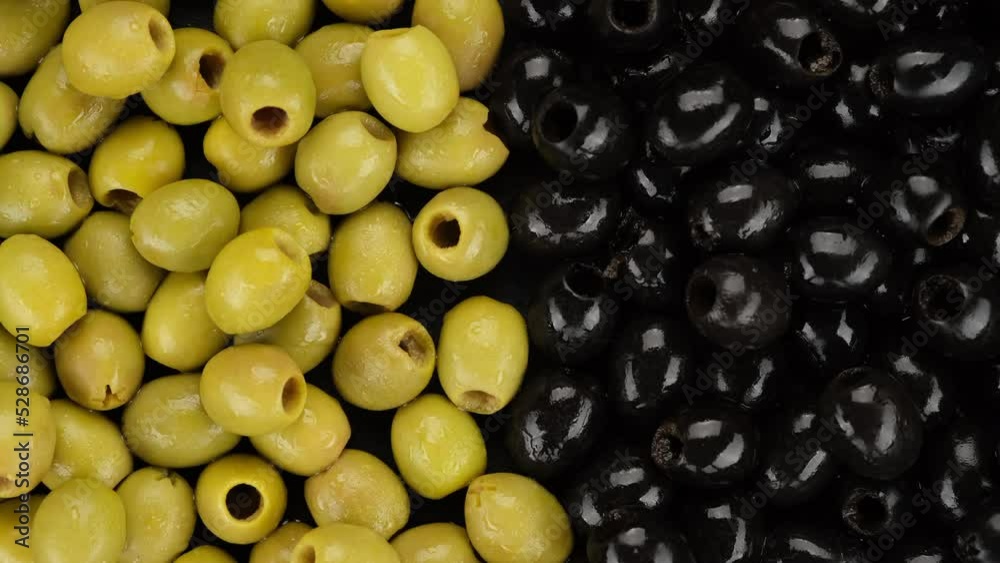 Olives. Black and green olives top view, slider shot. Pitted olives Olives. Black and green olives top view, slider shot. Pitted olives