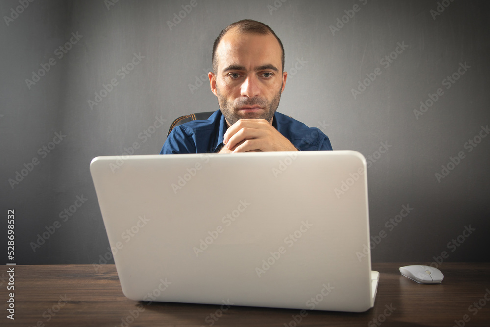 Caucasian man working with laptop computer. Caucasian man working with laptop computer.
