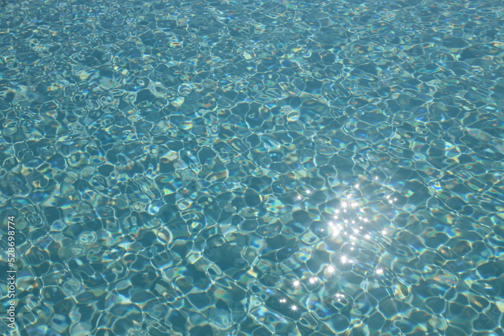 Sun reflection on the surface of a pool on a bright day Sun reflection on the surface of a pool on a bright day