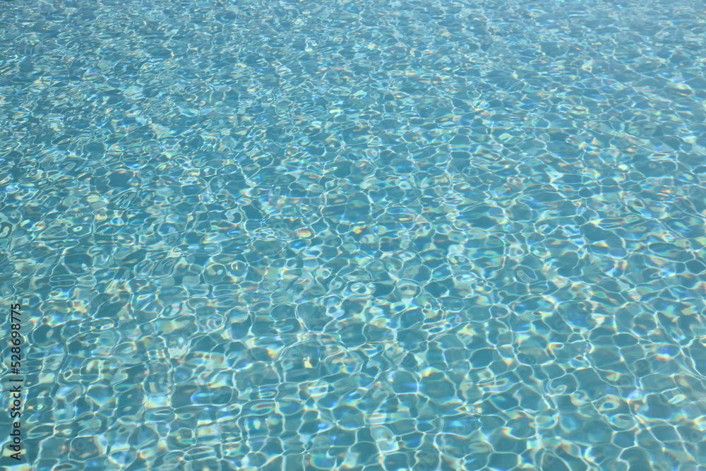 Water surface of a pool on a sunny bright day Water surface of a pool on a sunny bright day