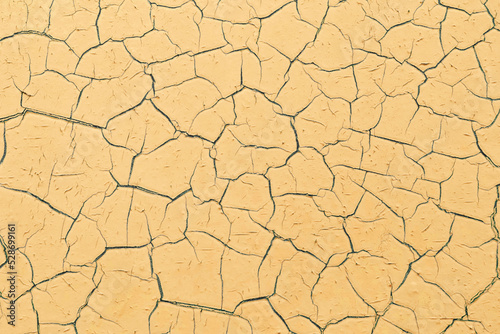 Background of yellow cracked surface