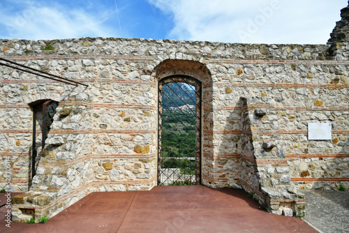 A window in the ruins of the castle of Quaglietta, a medieval village in the province of Salerno in Italy. photo