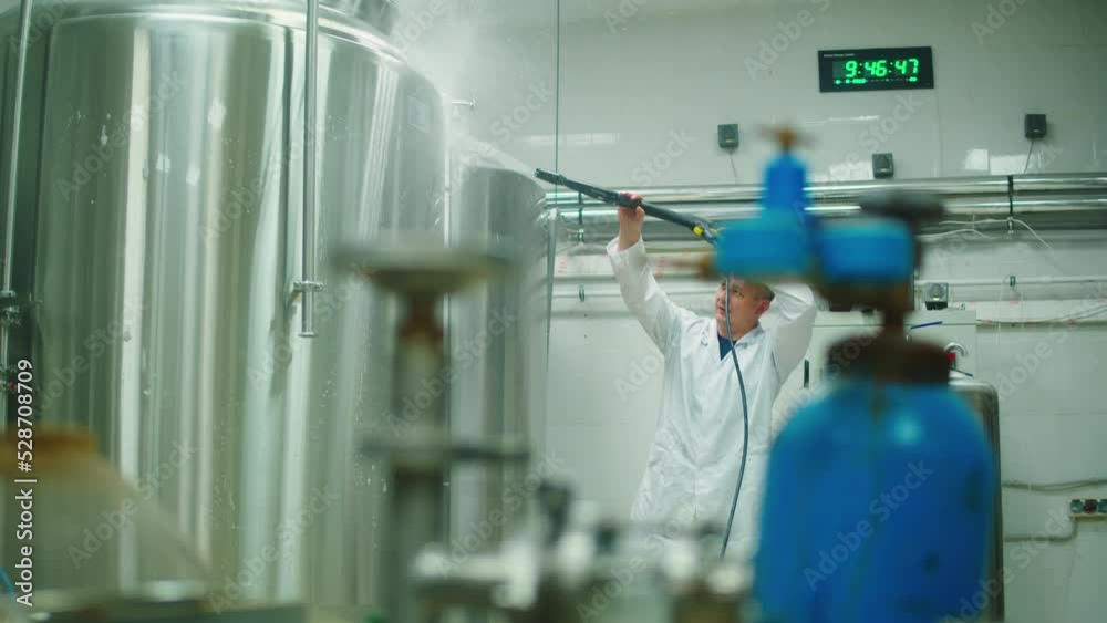 Craft beer production, general cleaning on factory, brewery manufacture. Washing metal vats bottles. Brewing, cooking alcohol. Craft beer production, general cleaning on factory, brewery manufacture. Washing metal vats bottles. Brewing, cooking alcohol.