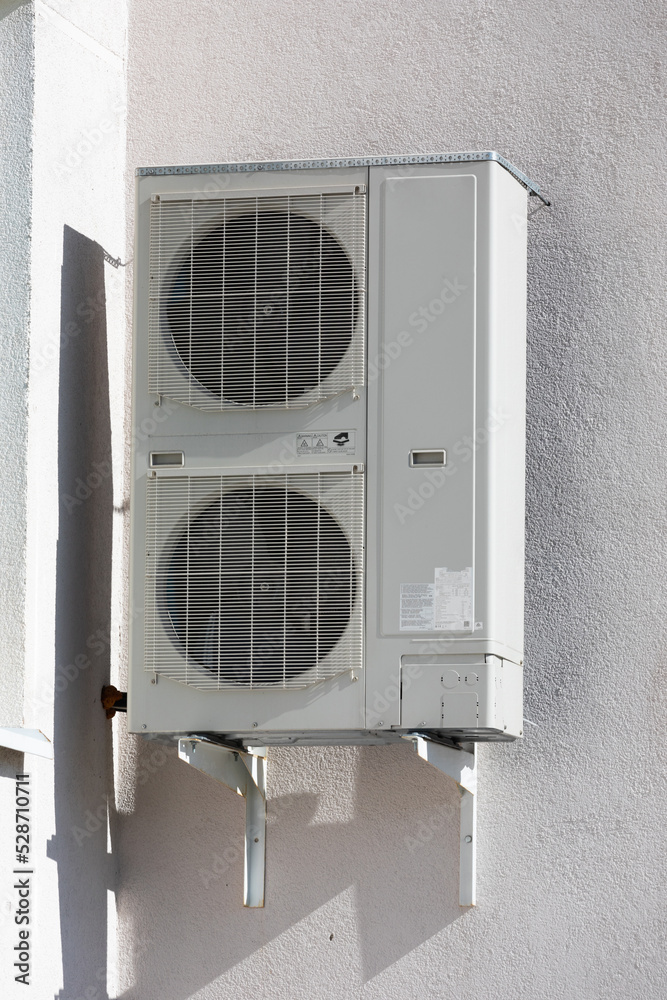 outdoor air conditioner unit with heat exchanger hanging outside the building outdoor air conditioner unit with heat exchanger hanging outside the building