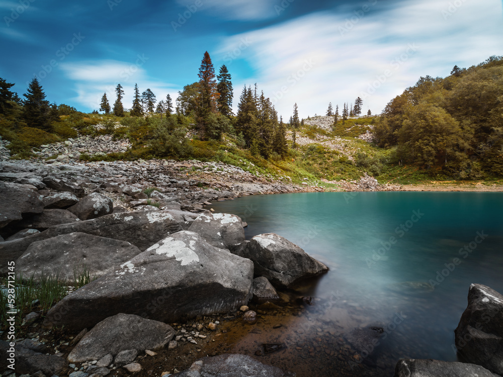 Turquoise lake in mountains, Mtsvane Lake, Georgia. Long exposure.