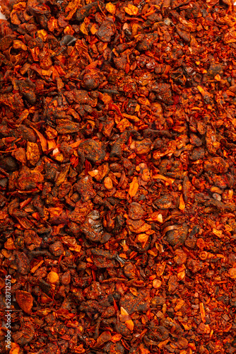Dried and sun dried tomatoes closeup, flat lay background. Indian and Arabic spices for cooking. Medicinal herbs and condiment.