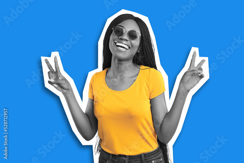 Carefree pretty black woman having fun, laughing and gesturing