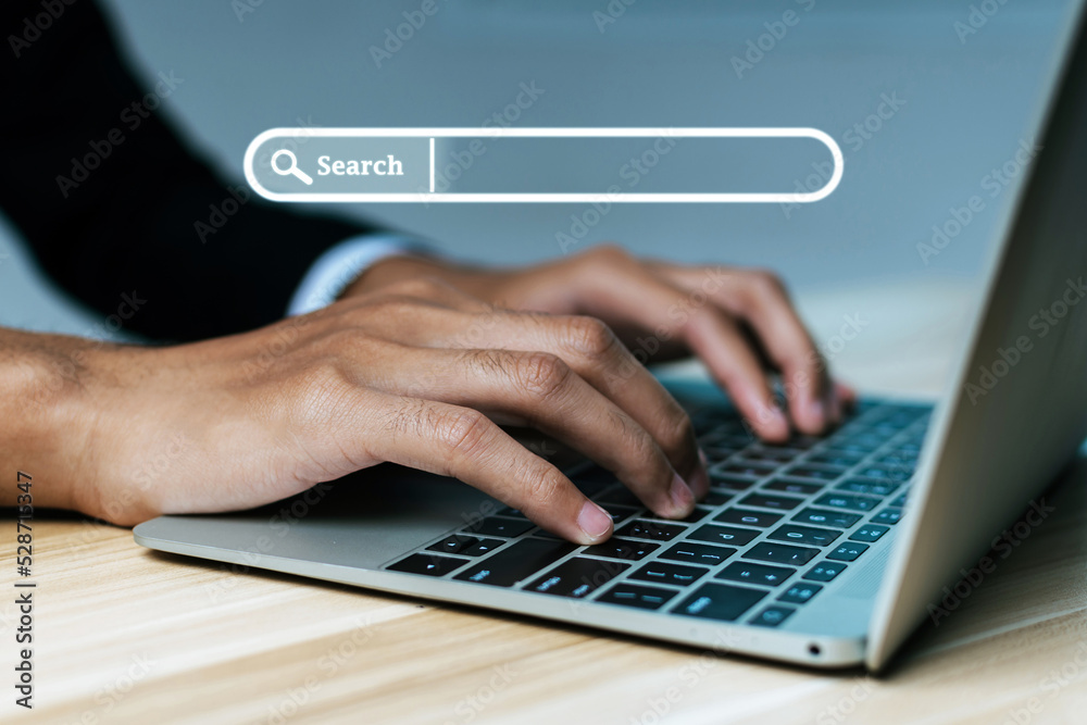 Website. businessman hand working on mobile laptop computer with virtual screen search button, searching browsing information, business finance, internet data technology and data search engine concept Website. businessman hand working on mobile laptop computer with virtual screen search button, searching browsing information, business finance, internet data technology and data search engine concept