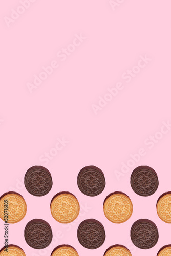 Pattern of cookies. Cookies on a pink background. Flat lay. Sweet cookies flat lay pattern on light pink background. Top view.