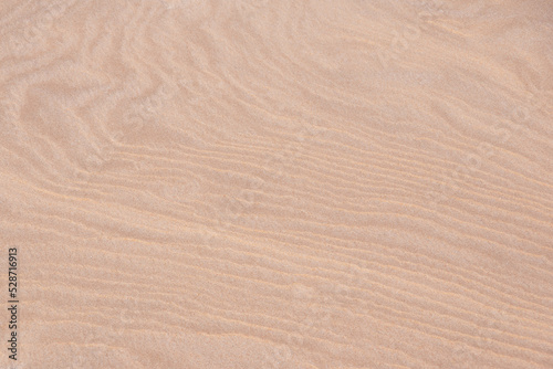 Top view on abstract pattern on the sand made by wind