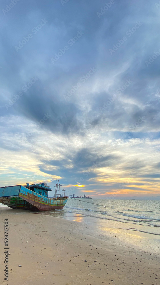 Shoreline portrait with a boat beside it Shoreline portrait with a boat beside it