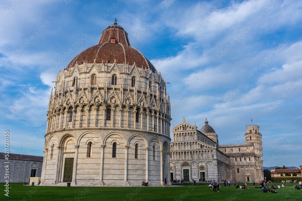 Pisa, Italy, 14 April 2022:  The Baptistery, Cathedral and leaning tower in Campo dei Miracoli