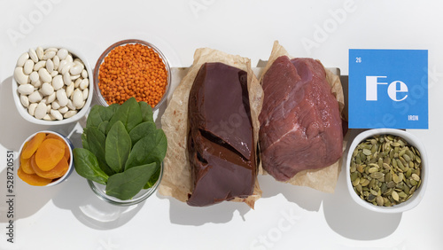 A group of healthy foods rich in iron. Healthy diet food. Cardboard sign with the inscription.