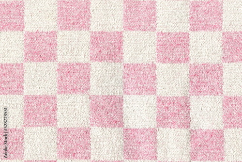 The texture of soft natural cotton flannelette warm fabric, blankets in white and pink check. Natural soft fabric background.