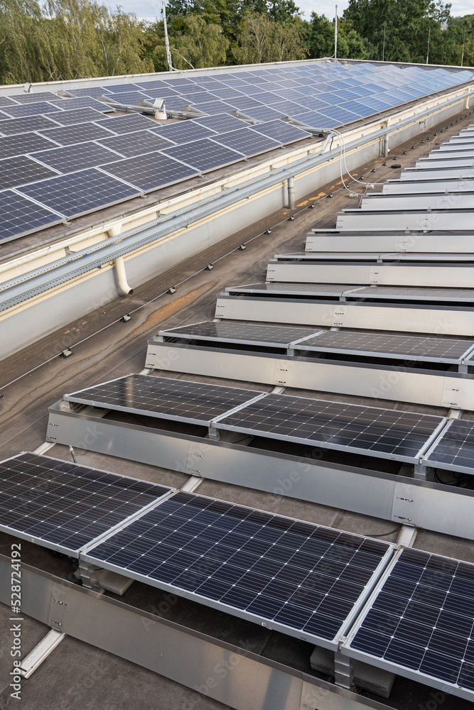 Picture of Solar panels on a flat roof. Stock Photo | Adobe Stock