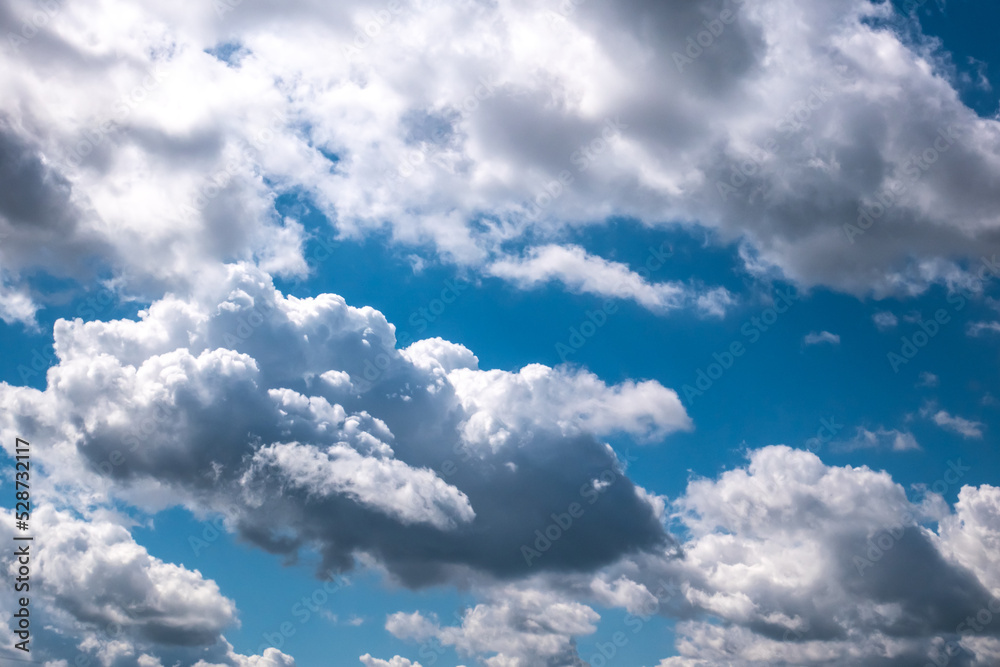 Fototapeta premium Soft focused view of beautiful thunderclouds. Beautiful dramatic blue sky background with fluffy clouds.