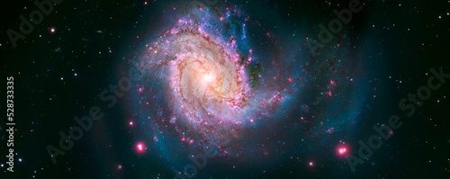 A spiral galaxy and stars in space. Elements of the image furnished by NASA.