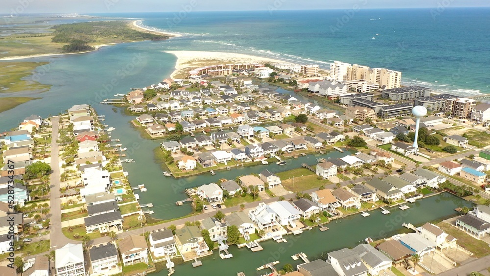 Vacation destination at the beach with houses, rental property and hotels along the coastline at Cherry Grove Beach, SC