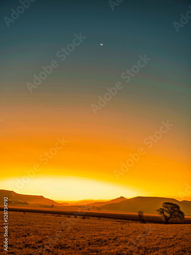 Clear sky and moon during sunset in Wakkerstroom village, Mpumalanga, South Africa