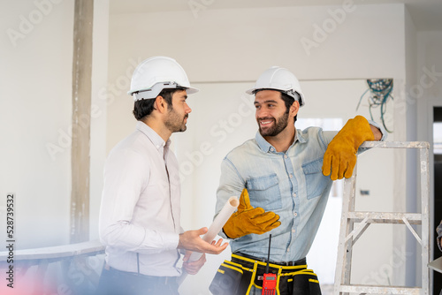 Group of engineer checking and talking about construction project with commitment to success at construction site,Construction concept.