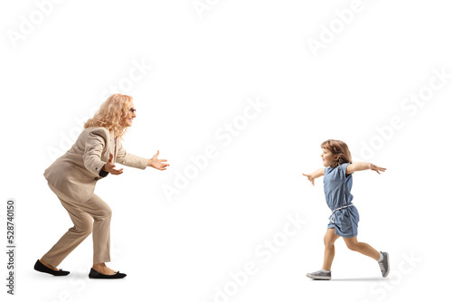 Little girl running to hug her mother