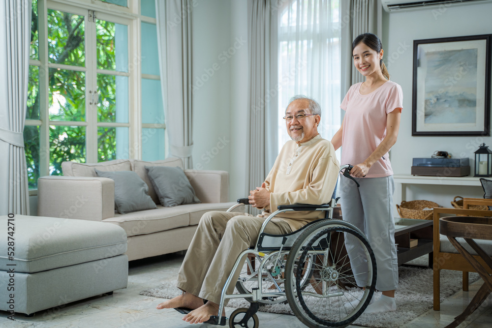 Caring daughter support assist positive father at home,Cheerful woman talking to old disabled father,Senior healthcare concept. Caring daughter support assist positive father at home,Cheerful woman talking to old disabled father,Senior healthcare concept.