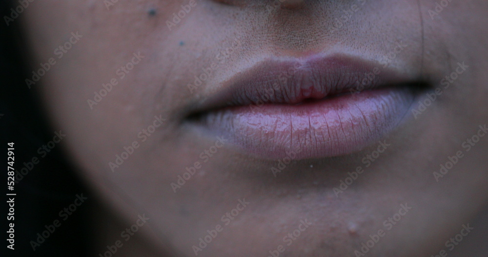 Closeup of black african woman mouth becoming serious Closeup of black african woman mouth becoming serious