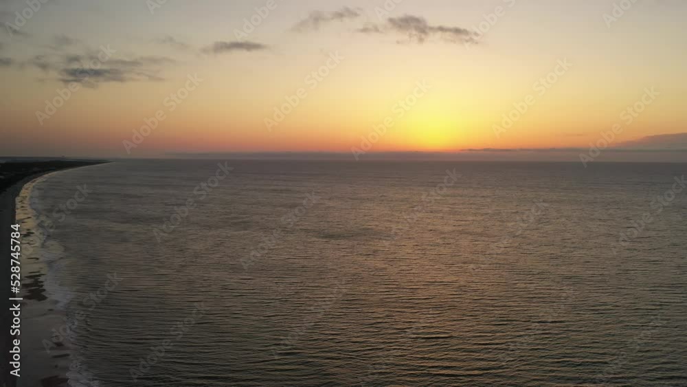 Early morning sky and sea along the beach coast in South Carolina, a popular vacation destination for peace and quiet reflection Early morning sky and sea along the beach coast in South Carolina, a popular vacation destination for peace and quiet reflection