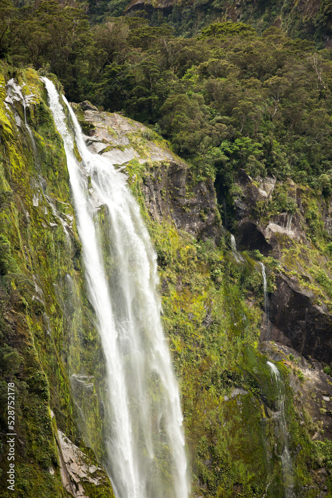 Beautiful waterfall in Milford Sounds New Zealand