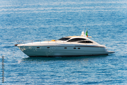 White luxury motorboat anchored in the Mediterranean Sea, Gulf of La Spezia, Liguria, Italy, southern Europe. © Alberto Masnovo