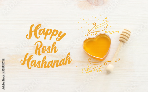 rosh hashanah (jewesh holiday) concept - honey traditional holiday symbol photo