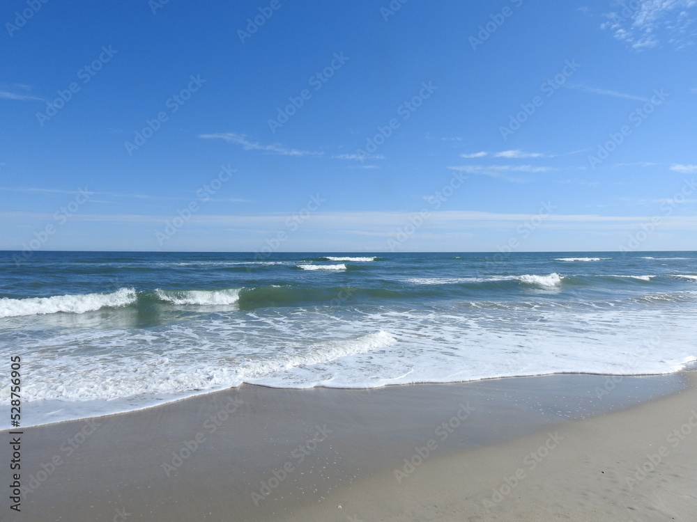 The natural beauty of the shore, along the Atlantic Ocean, on a calm spring day, off of Chincoteague Island, the Virginia side of Assateague. The natural beauty of the shore, along the Atlantic Ocean, on a calm spring day, off of Chincoteague Island, the Virginia side of Assateague.
