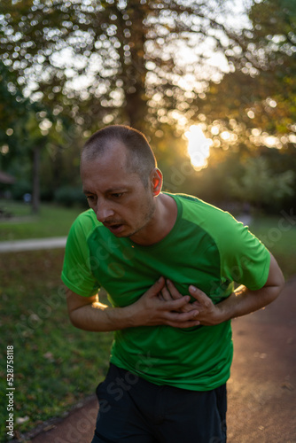 Fototapeta Naklejka Na Ścianę i Meble -  He is having pain in the chest due to heart disease, After he exercised by running up, to health care concept
