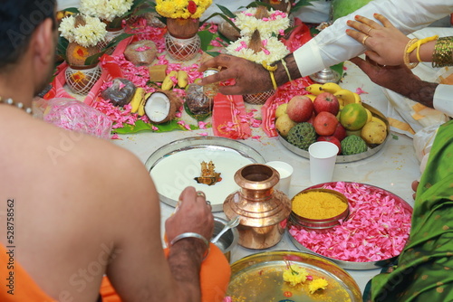 Bangalore, India 8th June 2022: Graha Pravesh. Grah or gruh Pravesh is a Hindu ceremony performed on the occasion of an individual's first time entering their new home. Hindu Hawan pooja Rituals.   photo