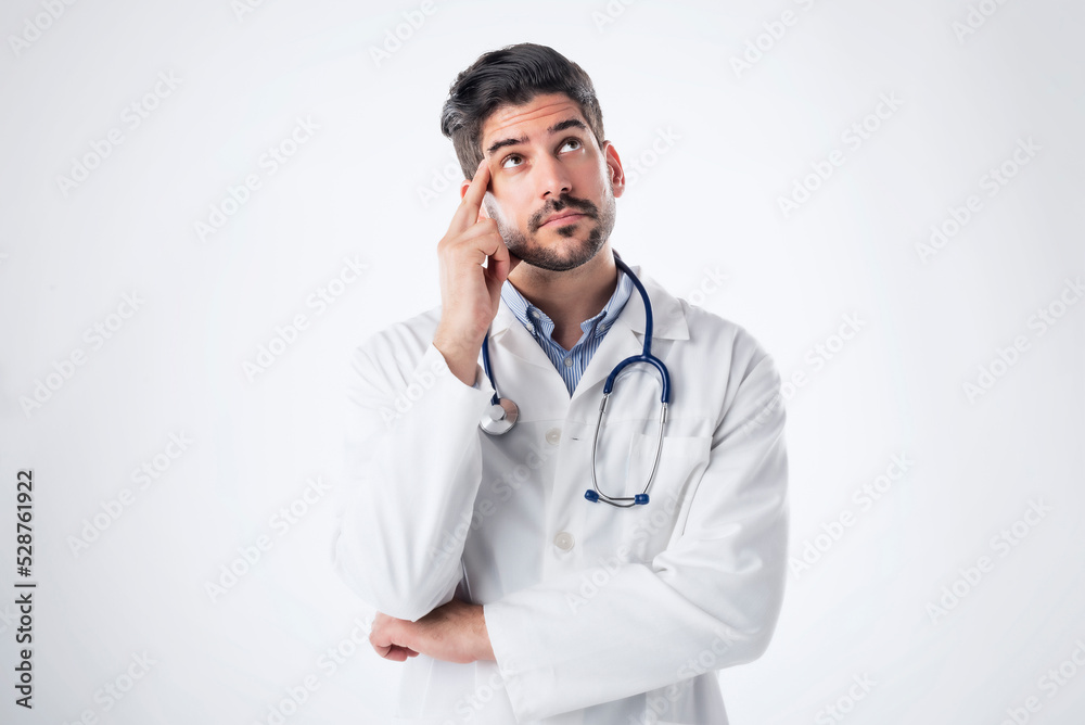 Thinking male doctor studio portrait Thinking male doctor studio portrait