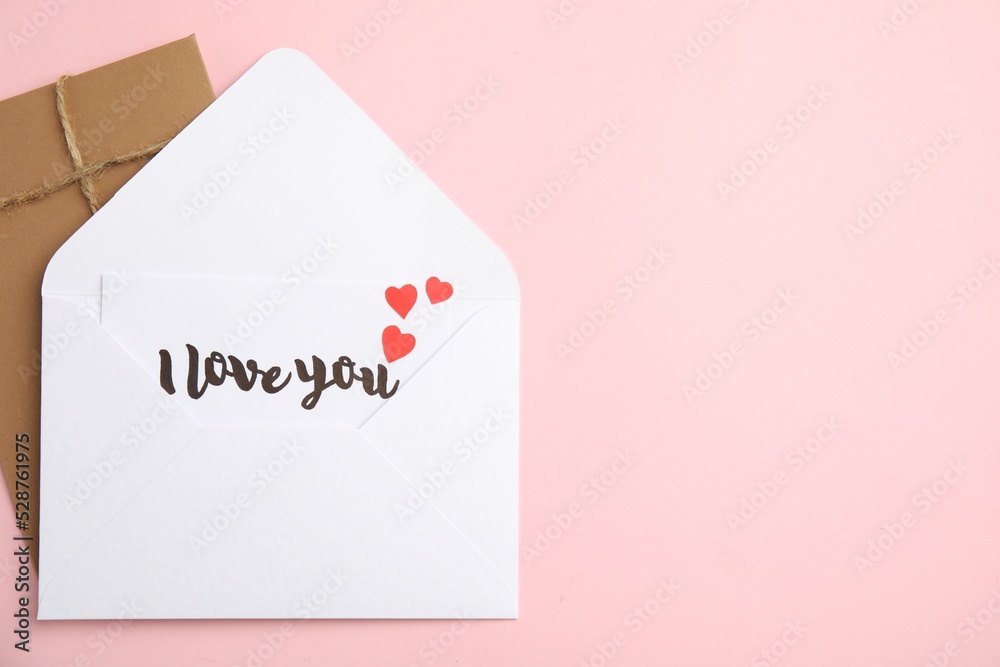 Love letter and envelope on pink background, flat lay. Space for text Love letter and envelope on pink background, flat lay. Space for text