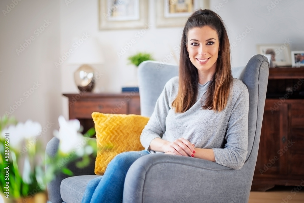 Smiling woman portrait while relaxing at home Smiling woman portrait while relaxing at home
