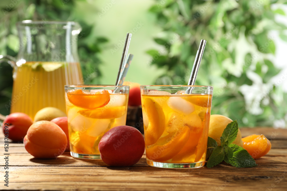 Fototapeta premium Delicious refreshing drink with apricot on wooden table