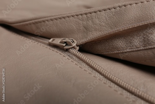 Pink leather jacket with zipper as background, closeup view