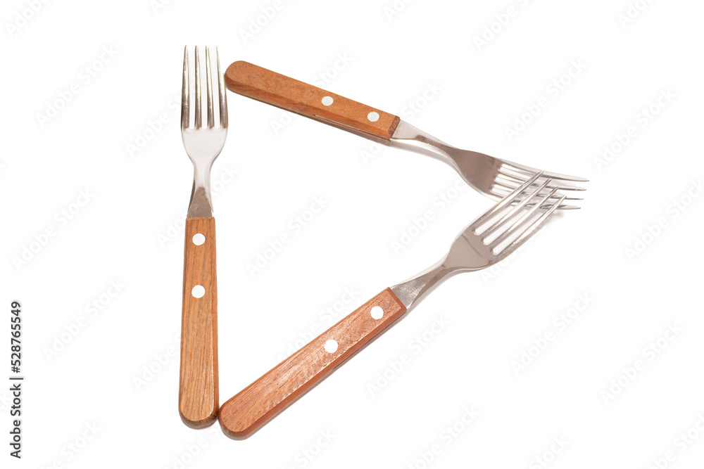 Naklejka premium 3 forks with wooden handles making the letter D on a white background