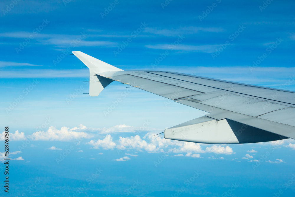 Airplane Window View with Airplane wing and Blue Sky Airplane Window View with Airplane wing and Blue Sky